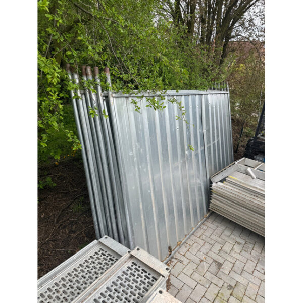 Used galvanized construction hoarding panels in storage