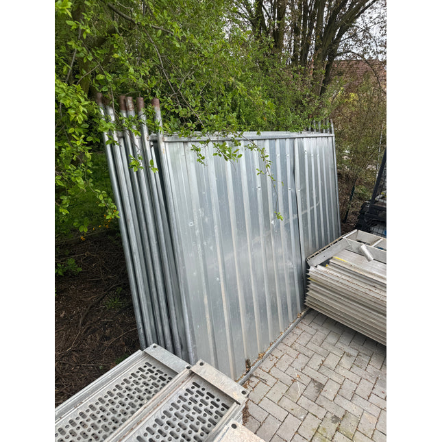 Used galvanized construction hoarding panels in storage