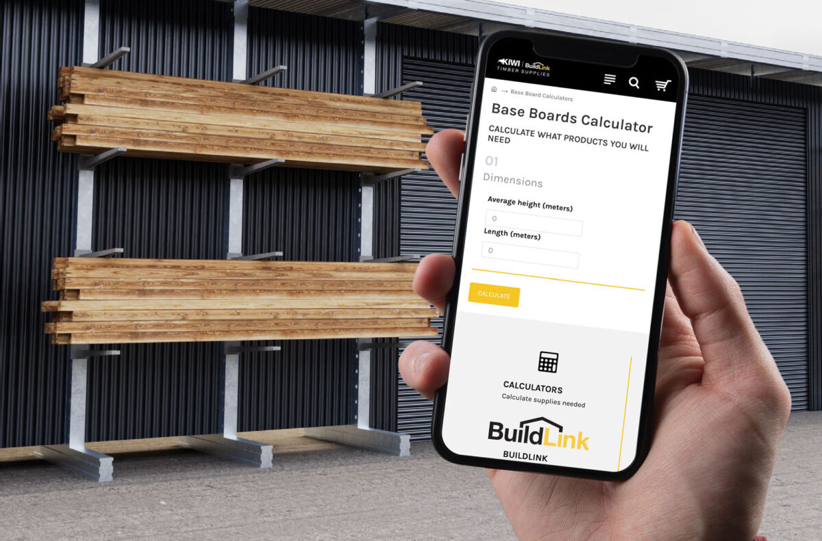 Timber estimating calculator shown on a phone beside stored construction timber